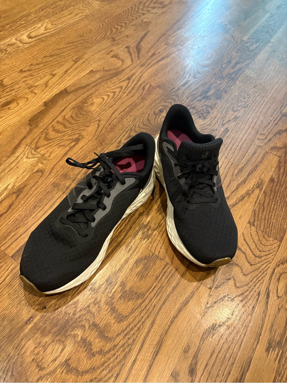 New Balance Black Athletic Running Shoes with White Midsole and Pink Insoles
